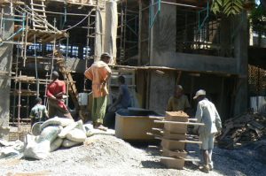 New construction in Lilongwe; each laborer has a separate job: