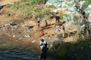 The Lilongwe River is muddy but useful for kids playing;