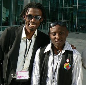 Ugandan activists Nkoyooyo Brian and Victor Juliet Mukasa.