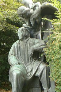 Statue with a guardian angel in Orsteds Park.
