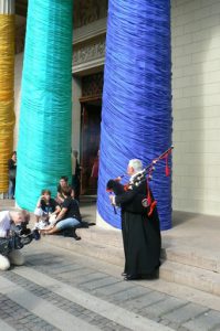 Cathedral clergyman welcoming people with his bagpipe