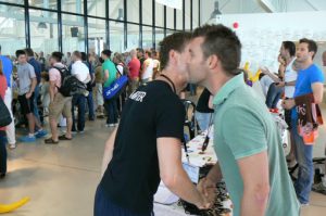 Swimmer being awarded his medal with a kiss.