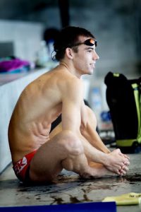 Team Denmark water polo player watching a match.