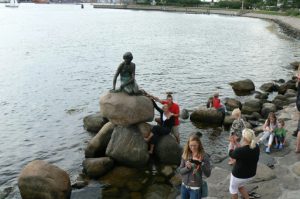 The famous ‘Little Mermaid’ bronze statue in Copenhagen harbor surrounded