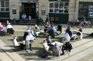 Sunny afternoon brings out the coffee and beer drinkers to