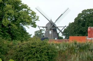 A restored windmill still operates to pump water.