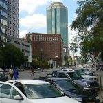 Harare: downtown business district - Monday traffic and new cars