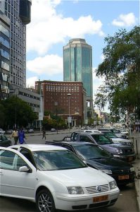 Harare: downtown business district - Monday traffic and new cars