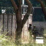 Walls with barbed wire surround the presidential mansion. Guarded by