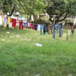 Laundry day brings some color to the grim scene.