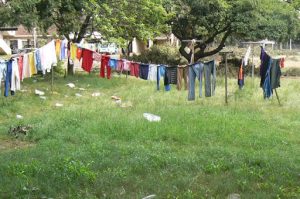 Laundry day brings some color to the grim scene.