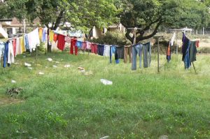 Laundry day brings some color to the grim scene.