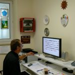 Meuse-American Cemetery--assistant superintendant Dominick showing vintage photos of the cemetery's