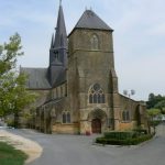 Church of St Medard, center, a former Augustinian priory variously