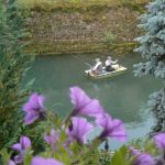 Fishing on a quiet morning on the green Meuse River.