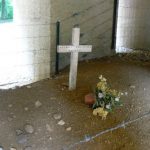 Inside the memorial structure is the actual trench filled in