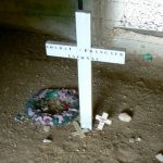 Inside the memorial structure is the actual trench filled in