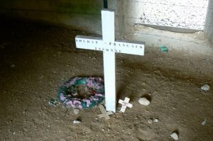 Inside the memorial structure is the actual trench filled in