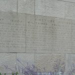 Stone wall inscription at the National cemetery