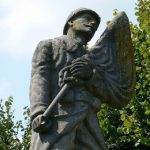 Detail of war St Juvin war memorial with a forlorn