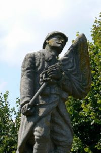 Detail of war St Juvin war memorial with a forlorn