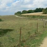 A dirt road leads uphill (north) behind St Georges where