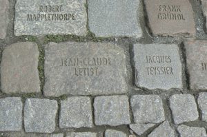 Cologne cobblestone memorial remembering victims of the AIDS epidemic, located