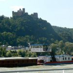 Barge traveling south below a castle Most of the castles date
