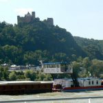Barge traveling south below a castle Most of the castles date