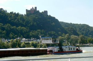 Barge traveling south below a castle Most of the castles date