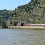 Train entering a tunnel at a narrow point of the