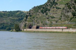 Train entering a tunnel at a narrow point of the