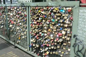 Locks (thousands) hooked to a fence on the Hohenzolern railway