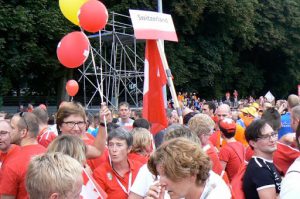 Athletes (from Switzerland) gather outside to form the procession to