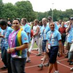 Athletes (from Long Beach, California) gather outside to form the