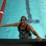 Happy swimmer Andrea at the end of her race