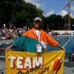 Richard Ammon with Team Orange County banner