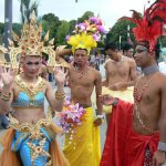 Athletes from Thailand gather outside to form the procession to