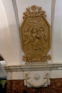 Heroic emblem in subway station.