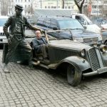 Bronze statue of a famous circus entertainer (with tourist in