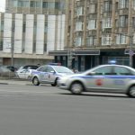 Police cars raced by in different directions in apparent confusion.