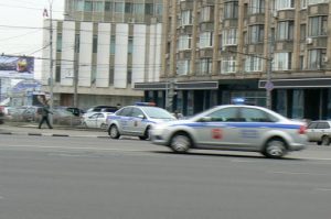 Police cars raced by in different directions in apparent confusion.