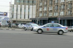 Police cars raced by in different directions in apparent confusion.