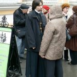 Priest at View of Alexander Nevsky Monastery