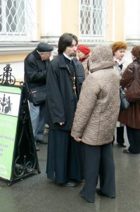 Priest at View of Alexander Nevsky Monastery