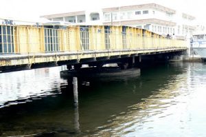 Bridge across the Belize River which divides the city