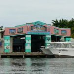 View of an arcade from water taxi to San Pedro