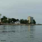 View of the lighthouse and condo tower from the water
