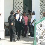 Lawyer talking outside courthouse