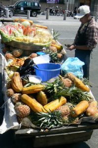 Fruit vendor in central plaza (Plaza de la Constitution)